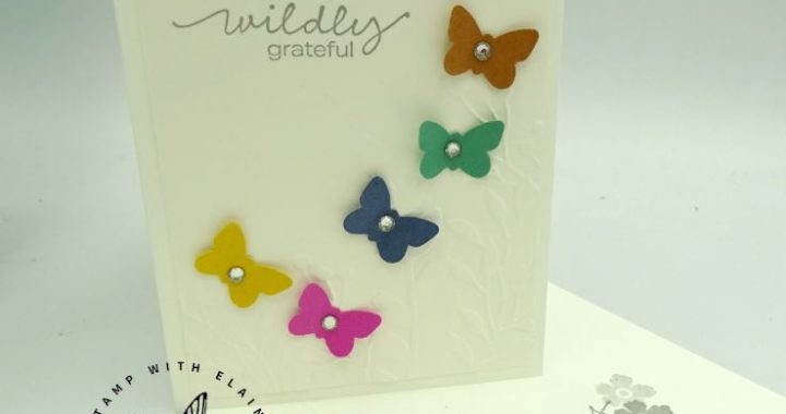 Embossed card with new in color butterflies