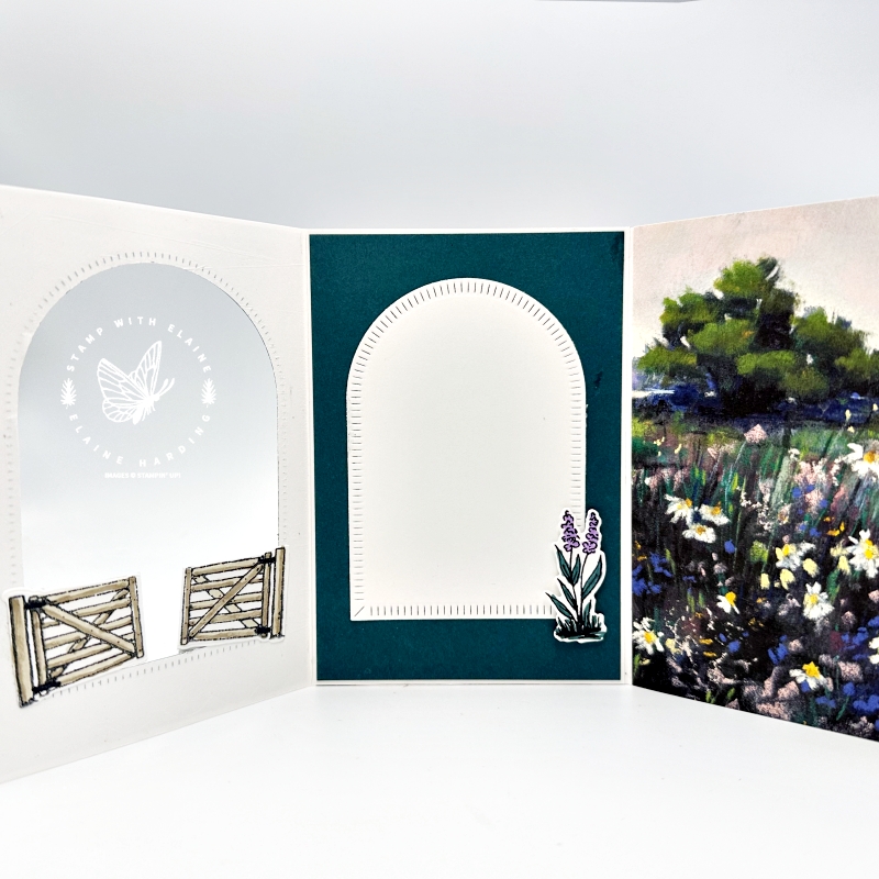 Trifold card open and showing the mirror technique stamped gates with Garden Meadows
