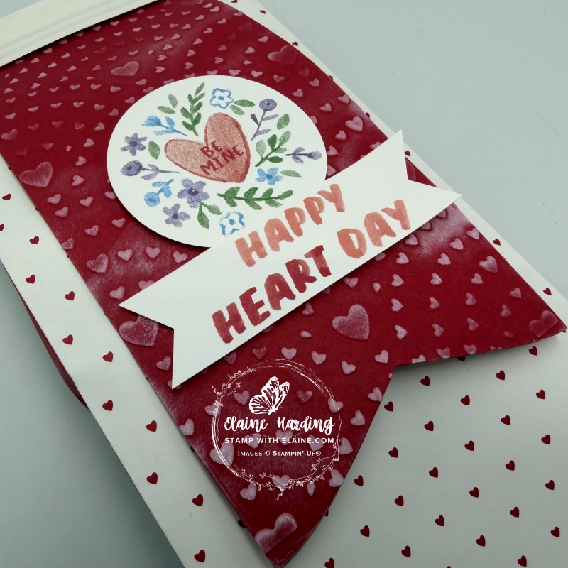 close up of embossed label with punched heart and sentiment cut from Love Notes DSP